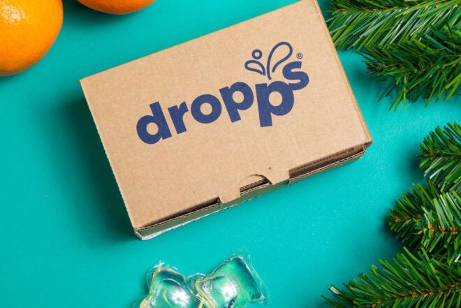 A package of Dropps detergent on a blue background.