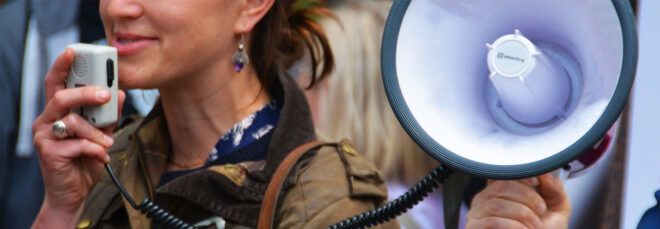 A person speaking into a megaphone.