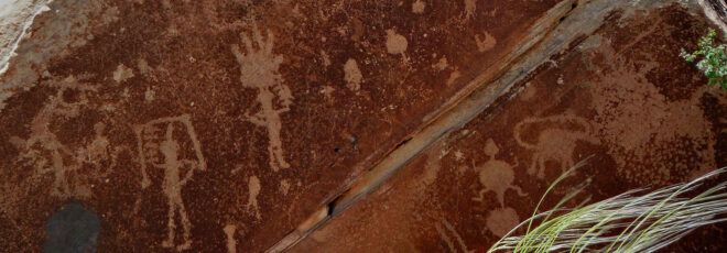 Figures drawn on a red rock.