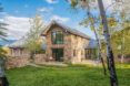 The exterior of a stone home.