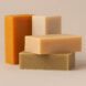Several bars of soap stacked against each other.