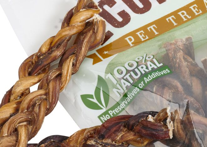 A close-up of a braided dog treat.