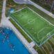 A closeup of the soccer field next to a basketball court