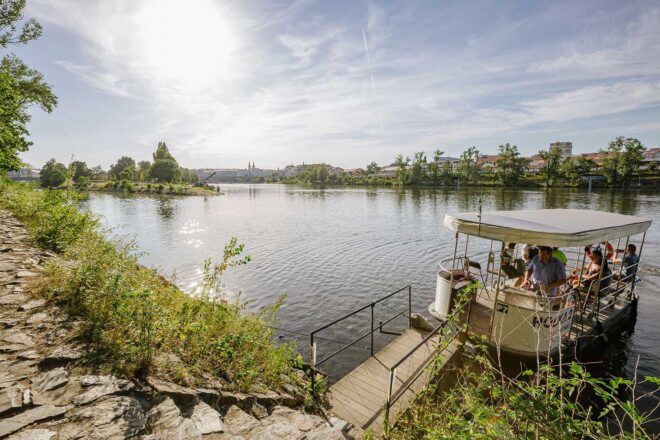 A staircase down to a small dock on the water.