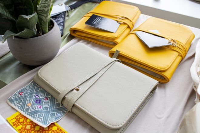 Two yellow bags with a tan bag in front of it