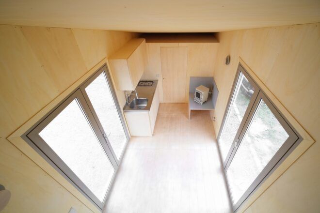 A small area for kitchen with two windows facing each other