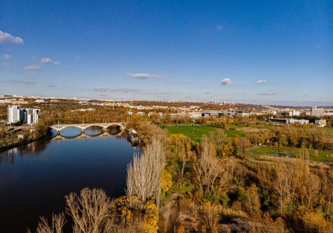 An aerial view of a community by a river.