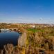 An aerial view of a community by a river.