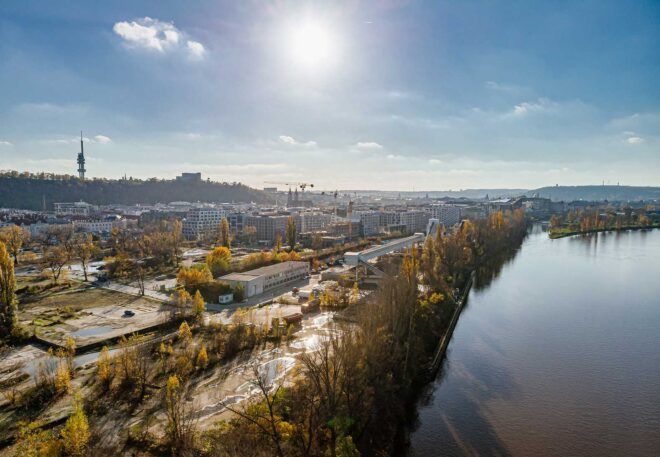 An aerial view of a community by a river.