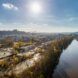 An aerial view of a community by a river.