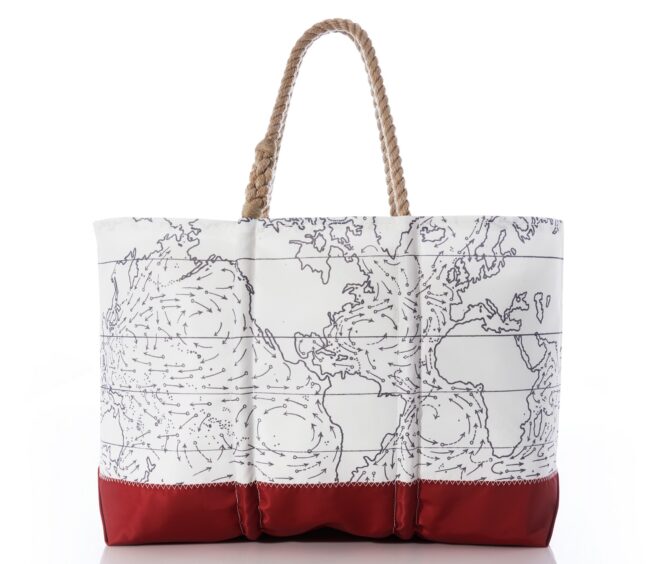 A tote bag that has a map of the globe patterned on it