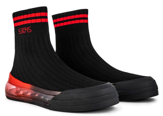 A pair of black and red shoes that look like socks.