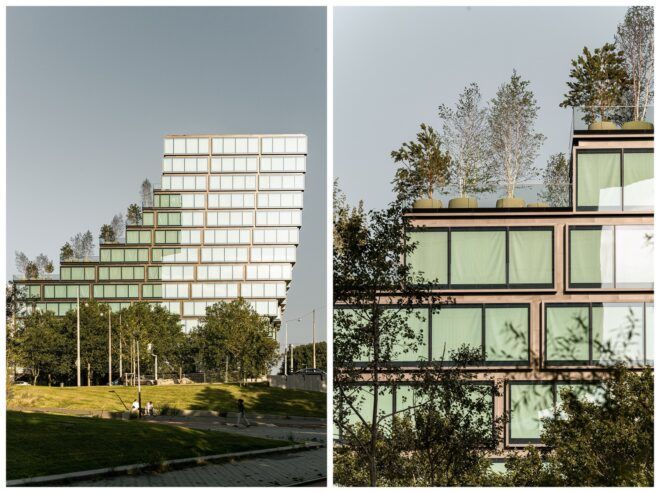 A far away photo of the building which has multiple windows stacked on top of each other and a close up of the green windows covered by trees
