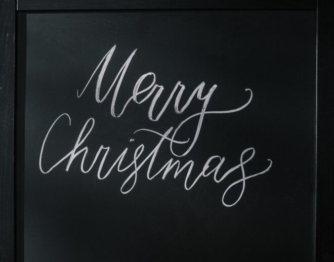 A chalkboard with the words "Merry Christmas" on it