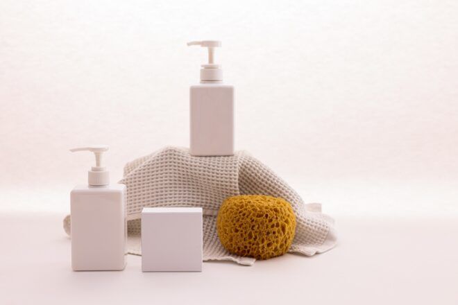 A set of toiletries with bottles and sponges