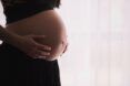 The belly of a pregnant person
