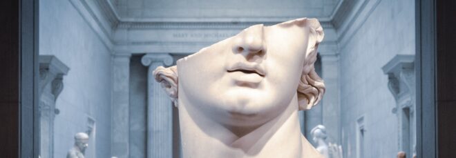 A sculpture of a man with his face sliced diagonally through