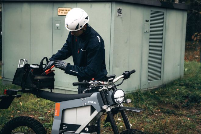 A person getting off an e-bike.