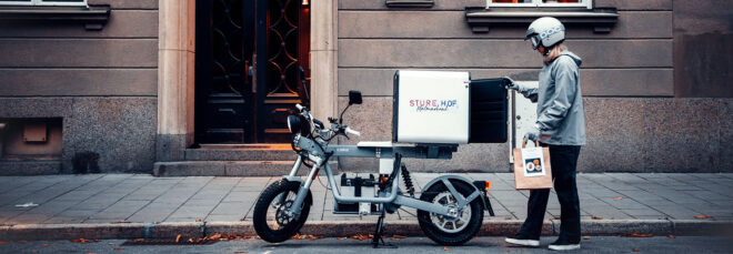 A e-bike parked on the side of the road.