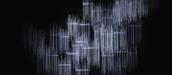 Dark empty stage lit up with suspended light rods installation