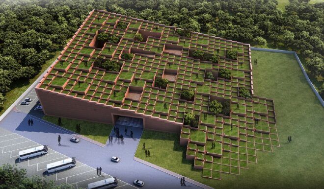 A slanting green roof structure that has a small opening for the building