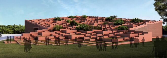 A clay-colored building that has varying roof structures clumped together and green roofing throughout it
