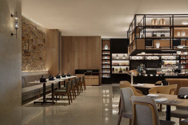 A dining area with a bar area in the righthand side