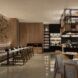 A dining area with a bar area in the righthand side