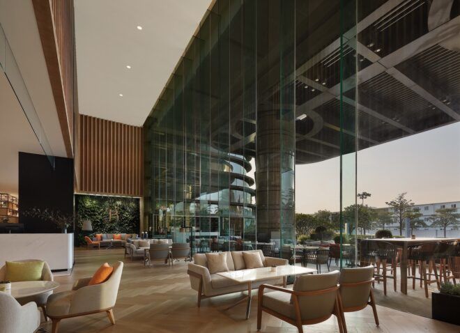 A seating area is next to a large glass wall