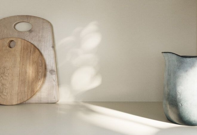 A kitchen counter with cutting boards.
