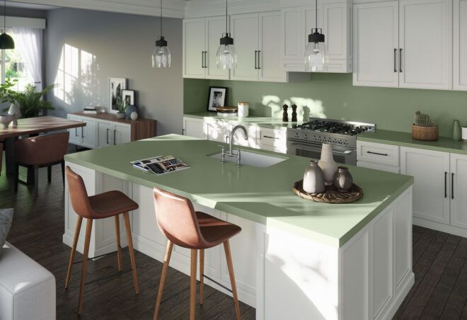 A kitchen in muted green tones.