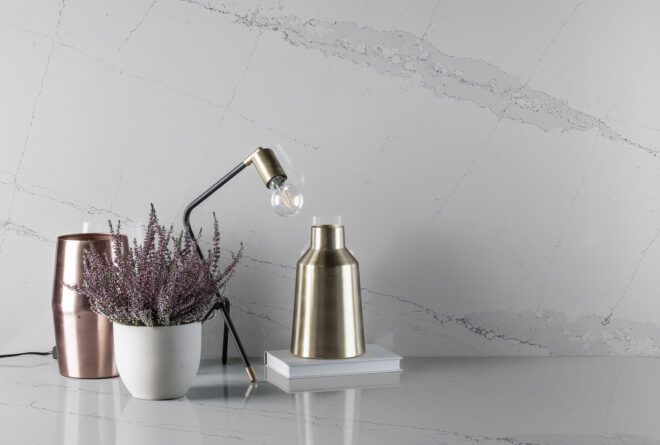 A desk area with marbled backsplash.
