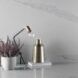 A desk area with marbled backsplash.