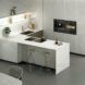 A kitchen with white marble features.