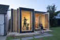 A dwelling unit for musicians including large windowed rooms
