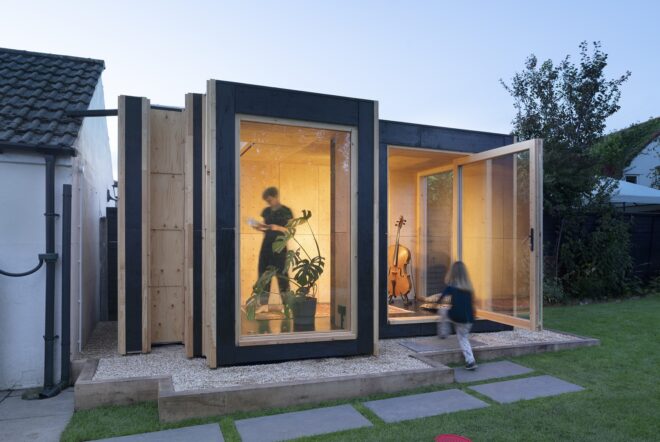 A dwelling unit for musicians including large windowed rooms