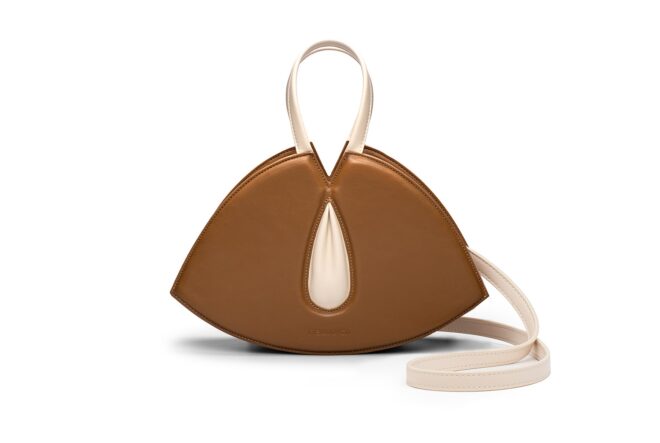 A brown handbag against a white background