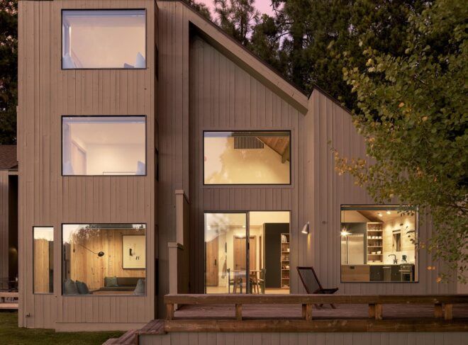 The exterior of a home with a roof that slopes down to the right.