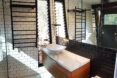 A bathroom with white and black features.