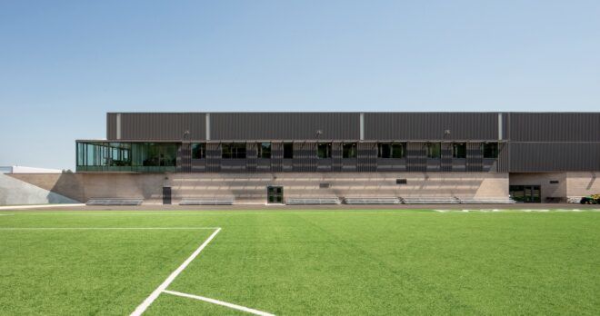 An outside green soccer field