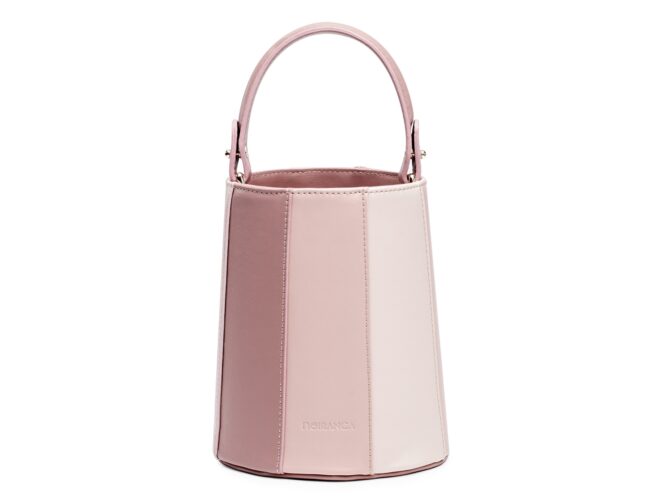 A pink bucket handbag against a white background