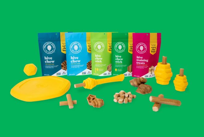 Bags of dog treats and toys, from left to right, dark blue, light blue, light green, dark green and red bags