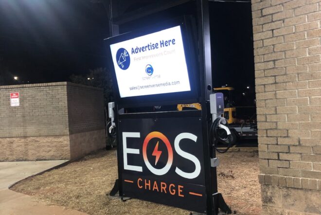 A sign at the top reads advertising here while the bottom panel reads EOS Charge