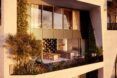 The outside balcony area of an apartment complex facing the sun