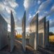 Standing wooden slats lined up in a curved formation