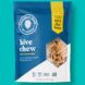 A dark blue Hive Chew bag against a teal background