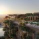 The top of a hi-res building where there is a pool and the city horizon as a stretch of distance