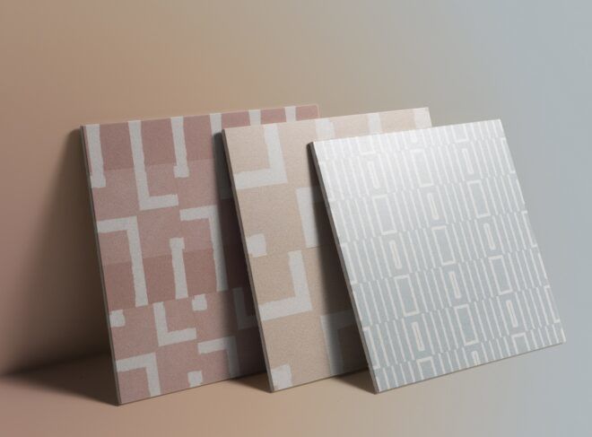 Three square tiles, a mauve color, a light pink color and a light blue color