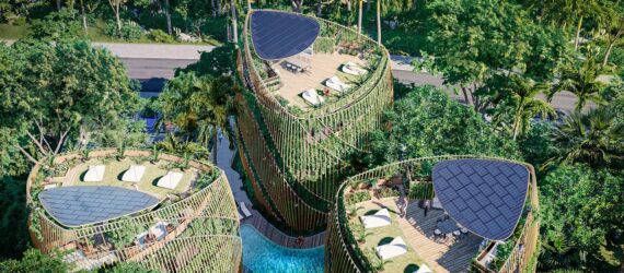 An aerial view of the top of the triangle-shaped buildings has chairs for sunbathing