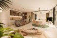 A long room that contains a living room and kitchen area